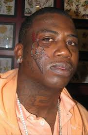 Lil wayne has 3 dots tattooed near his left eye, which represent laugh, think and cry. Gucci Mane Gets New Ice Cream Face Tattoo Billboard
