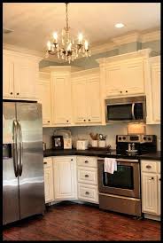 Love Cupboards That Are Different Heights And Love The White With Dark Pulls By Delia Home Kitchens Kitchen Remodel Kitchen