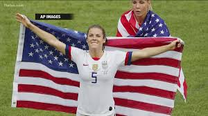 Fayetteville's Kelley O'Hara wins over the internet with US flag rescue,  post-game kiss, locker room celebration