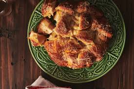 — that was the sound of the biscuit can popping open. Transform Ho Hum Refrigerated Biscuits Into This Garlicky Oregano Monkey Bread
