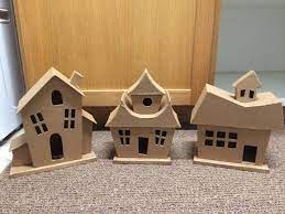 Found These Cardboard Houses At Walmart To Create Our Whoville Project Cardboard Gingerbread House Cardboard House Whoville Christmas