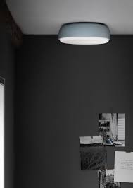 This Flush Mounted Light Is Stylish And Sleek Comprised Of A Smooth Metal Frame And A Glowing Glass Disc Above S Rou Ceiling Light Design Ceiling Lights Lamp