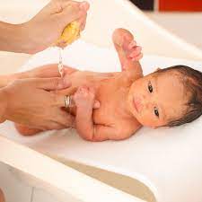 Keep your baby's head clear of the water. Reasons To Delay Baby S First Bath