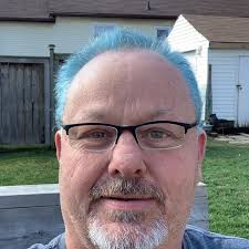 Charlie Nebo and Nicholas Janis pose for a picture while Charlie is passing  through, as many put it. This is because Charlie never really put a stamp 