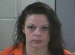 Suspicious female subject sleeping in a yard