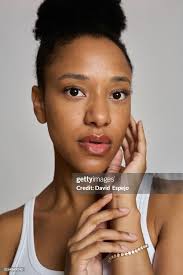 Young Actress Posing And Touching Her Face With Afro Hairstyle High-Res  Stock Photo