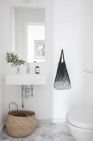 Minimalist White Scandinavian Bathroom With Belly Basket Top 10 Tips For Adding Scandinavian St Small Bathroom Decor Bathroom Interior Small Bathroom Remodel