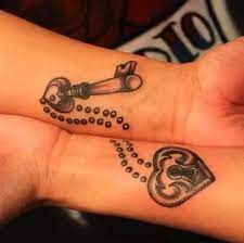 Black ink heart lock with key and butterfly tattoo design. 15 Stylish Key Tattoo Designs And Pictures Styles At Life