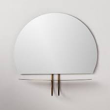 White jolly to create a finished edge or transition between tiles. Kemper Half Circle Brass Shelf Mirror