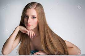 Beautiful young woman with gorgeous hairstyle posing over white. Young Woman With Long Beautiful Hair Young Long Haired Woman Stock Photo Picture And Royalty Free Image Image 95178171