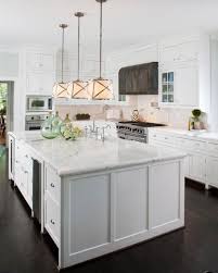 See more ideas about white countertops, countertops, popular kitchen designs. Bright Transitional Kitchen With White Marble Countertops And Cabinets Over Dark Hardwood Floor Hgtv