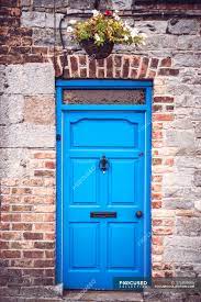 If you have a brick exterior, you may think there aren't many front door color choices, but you'd be surprised how many tones and hues work well with brick. Bright Blue Door In Brick Wall Of Rural House Doorway Architecture Stock Photo 176895666