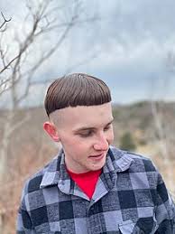 A bowl cut, or mushroom cut, is a simple haircut where the front hair is cut with a straight fringe (see bangs) and the rest of the hair is left longer, the same length all the way around. Bowl Cut Wikipedia