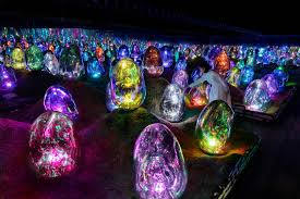 Glowing orbs scattered across a moss landscape in the Moss Garden of Resonating Microcosms