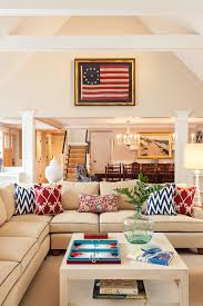 In a mostly pale room, a plaid blanket makes a strong statement. Decorating With Red White And Blue Town Country Living