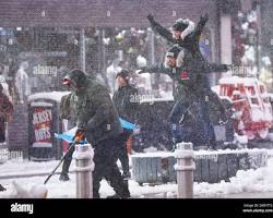 Image of people enjoying snow in NYC