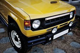 mitsubishi pajero hyundai galloper mohenic garages redesign original classic mohenic yellow garage redesign mitsubishi pajero garage storage solutions