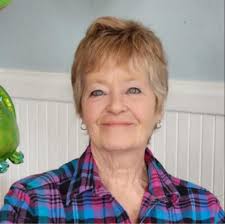 I need help with this brick wall in the family room, it overwhelmes me when  I look at it. Thinking about white washing but do not know how to decorate  it. Thank