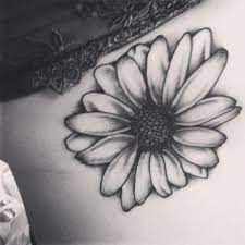 White daisies are very popular, but they can come in a variety of colors as well. Daisy Flower Tattoo Black And White White Daisy Tattoo Daisy Tattoo Daisy Flower Tattoos