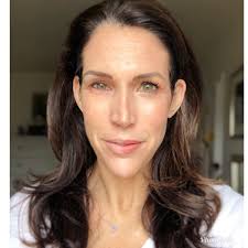 Last minute half face makeup check before hanging out with family