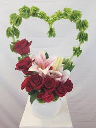 Red Roses W Bells Of Ireland Heart Valentine S Day Flower Arrangements Church Flower Arrangements Valentine Flower Arrangements