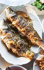 Whole Roasted Branzino With Fennel And Onions Whole Fish Recipes Fish Recipes Seafood Dishes