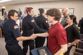 Father and stepson recognized with Paris Standing Ovation Award