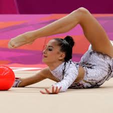 An olympic medal event since 1984, rhythmic gymnastics is performed in individual and group competitions using hoops, balls, clubs and ribbons. Olympic Photo Of The Day Rhythmic Gymnastics Athlonsports Com Expert Predictions Picks And Previews
