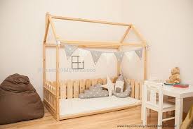 Montessori Crib Size Floor Bed Is An Amazing For Baby Room Interior Where Children Can Sleep And Play It Is Un Toddler Bed Frame House Frame Bed Kids Room Bed