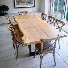 The chairs showcase high ladder backs for support. Tables Single Slab Live Edge Oak Dining Table Slab Dining Tables Oak Dining Table Live Edge Kitchen Table