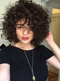 This style of short curly hair requires little styling to look these short thick curls are great to show off the hair's fullness and volume. Short Hairstyles For Thick Curly Hair Hair Styles Thick Hair Styles Curly Hair Styles