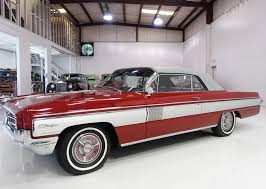 Image result for Garnet Maroon 1931 Oldsmobile