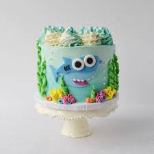 Add a little white frosting to the blue frosting, and use an offset spatula to make wave patterns. September S Cake Decorator Spotlight Find Your Cake Inspiration