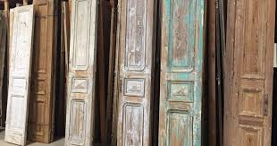 Add glass panels or mirrors to the door to make the sun sparkle a bit more off the area. 15 Ways To Use Old Doors In Your Garden