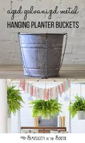Porch Decorating Idea Using Aged Galvanized Buckets As Hanging Planters This Tutorial Gives You A Bucket Planters Hanging Planters Outdoor Diy Hanging Planter