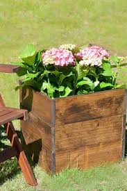 Simple stakes beside each plant to which each tomato plant is tied. 30 Best Diy Planter Box Ideas And Tutorials For 2021 Crazy Laura
