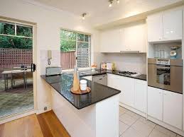 Matching the stools to the appliances is a nice idea. Modern Kitchen Cabinet Design U Shape