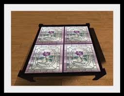 Priviste glass coffee table is cleverly curved to form a useful magazine or book storage area. Second Life Marketplace Rose Stained Glass Coffee Table