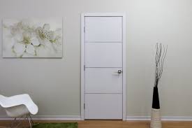 Modern white living studio with bedroom doors open. Laminated Series Interior Doors Nova Interior Doors