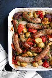 Roasting Pan Filled With Cooked Sausage Potatoes Bell Pepper And Onions Sweet Italian Sausage Recipes Sausage Recipes For Dinner Sausage Dishes