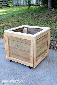 Make this upside down tomato planter more appealing with a decorative cover. How To Make A Rolling Planter Box I Should Be Mopping The Floor