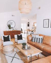 Beautiful Minimalist Living Room Tan Couches And Bohemian Modern Wooden Pieces Bright Living Room Minimalist Living Room Living Room Inspiration