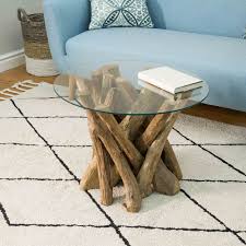 Coffee tables are usually the one piece of furniture that is the centre piece of the living room; Ashdown Natural Teak Root Round Coffee Table With Glass Collingwood Batchellor