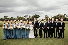 Wedding Party With Groomsmen In Black Tuxedos And Light Blue Ties And Bridesmaids In Dusty Blue Halter S Blue Groomsmen Slate Blue Wedding Blue Themed Wedding