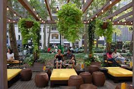 The Alfresco Lounge Features Porch Swings And Stools For Seating Porch Swing Alfresco Japanese Dining Table