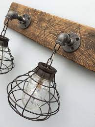 Ideal for a rustic farmhouse or nautical bathroom theme, this vanity light captures the eye with its authentic galvanized steel finish bathroom vanity light: Find Bathroom Light Fixtures 8 Lights That Look Beautiful Rustic Light Fixtures Rustic Bathroom Light Fixtures Rustic Bathroom Lighting