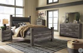 Footboard has embossed textural panel within a simple frame and tapered leg. Wynnlow Brown Upholstered Poster Bedroom Set From Ashley Coleman Furniture