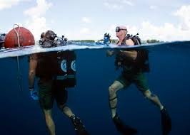 Hospital Corpsman 1st Class Virgil Newton, assigned to Underwater ...
