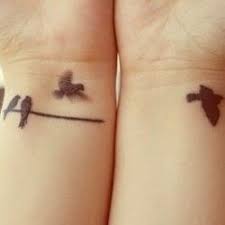 Tiny Birds On A Wire Tattoo Small And Elegant Tattoo Ahhhrt Pinterest Birds Tattoo And Wire Trendy Tattoos Elegant Tattoos Bird Tattoo Wrist