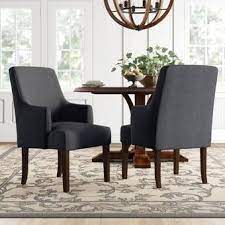These arm chairs rest on ornately turned legs in a shimmery gray finish. Evelina Solid Wood Dining Chair Reviews Birch Lane Comfortable Dining Chairs Dining Room Arm Chairs Dining Chairs